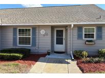 Charming single-story home featuring a cozy front entrance with manicured landscaping and inviting decor at 1152 Villa Ln # 104, Apopka, FL 32712