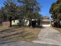 Charming single-story home features a well-manicured lawn and a convenient attached garage at 13 Spring Loop, Ocala, FL 34472