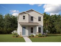 Charming two-story home with vertical siding, stone accents, and a well-manicured lawn at 16746 Hamlin Vista Aly, Winter Garden, FL 34787