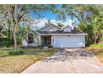 Charming single-Gathering home with a well-manicured lawn and a two-car garage in a desirable neighborhood at 600 Arlington Ct, Eustis, FL 32726