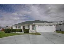 Charming single-story home with a two-car garage and well-maintained landscaping at 3067 Southern Trce, The Villages, FL 32162