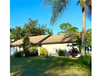 Charming single-story home with a well-maintained lawn, mature landscaping, and bright exterior paint, perfect for a welcoming curb appeal at 377 Courtland Blvd, Deltona, FL 32738