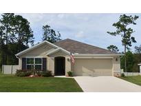 Charming one-story home with a well-manicured lawn and a neutral-colored exterior at 7133 Sw 135Th Pl, Ocala, FL 34473