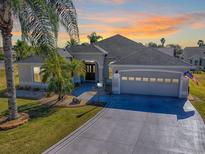 Charming single-Gathering home with a well-manicured lawn and a two-car garage at 998 Sayle St, The Villages, FL 32162