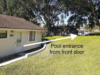 Charming home featuring a well-manicured lawn and access to a community pool at 10301 Us Highway 27 # 39, Clermont, FL 34711