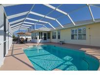 A refreshing screened-in pool, perfect for outdoor relaxation and entertaining near the home at 17490 Se 110Th Ter, Summerfield, FL 34491