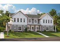 Charming new construction townhome boasts impeccable design, a spacious lawn, and a welcoming front porch at 9964 Rodbell St # 119A, Orlando, FL 32827