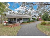 Charming single story home with screened porch and beautiful landscaping at 17561 Seidner Rd, Winter Garden, FL 34787