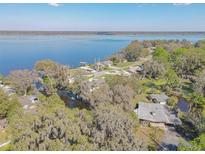 An aerial view of a waterfront community nestled along a serene lake at 2439 Cr 453, Lake Panasoffkee, FL 33538