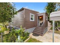 Charming single-Gathering home featuring horizontal siding, a small front porch, and well-maintained landscaping at 4552 Cr 300, Lake Panasoffkee, FL 33538