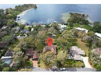 Aerial view of the property showing proximity to a lake and surrounding neighborhood at 925 Northside Dr, Mount Dora, FL 32757