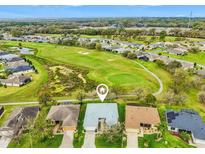 An aerial view of the home backing onto the community golf course at 26821 Augusta Springs Cir, Leesburg, FL 34748