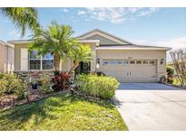 Charming single-Gathering home with a two-car garage, lovely landscaping, and attractive stone accents at 5262 Royce Dr, Mount Dora, FL 32757