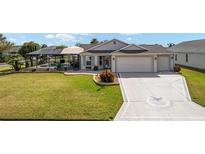 Charming single-story home boasts a well-manicured lawn, screened-in pool, and a spacious two-car garage at 592 Netherwood Pl, The Villages, FL 32163