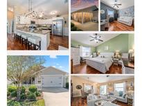 Bright kitchen with stainless appliances, center island, and pendant lighting at 2602 Young Ln, The Villages, FL 32163