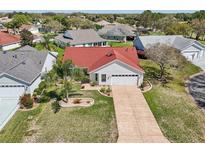 Charming single-story home with a well-manicured lawn and inviting curb appeal at 750 Evelynton Loop, The Villages, FL 32162