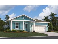 Charming single-story home with a covered porch, blue siding, white trim, and a well-manicured front lawn at 981 Fiesta Key Cir, Lady Lake, FL 32159