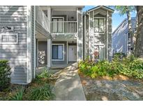 Charming two-story condo with well-maintained landscaping and a private balcony at 2210 Stonington Ave # 2210, Orlando, FL 32817