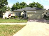 Well-maintained one-story home with manicured lawn and mature landscaping at 2294 Caledonian St, Clermont, FL 34711