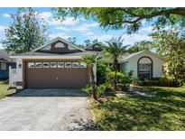 Charming single-story home with a well-manicured lawn and inviting curb appeal at 815 Thousand Oaks Blvd, Davenport, FL 33896