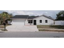 Well-kept single-story home with attached garage and inviting front yard, great curb appeal at 2600 Pisces Dr, Orlando, FL 32837