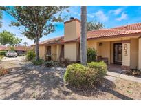 Charming single-story home featuring a tile roof, neutral paint, and well-maintained landscaping at 5045 Maui Cir # 12, Orlando, FL 32808