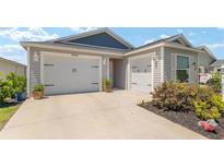Charming home featuring a three-car garage, well-kept landscaping, and excellent curb appeal at 6342 Whittle Ct, The Villages, FL 32163