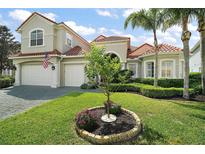 Charming home with well-maintained lawn and decorative landscaping in a desirable neighborhood at 2497 Heritage Green Ave, Davenport, FL 33837