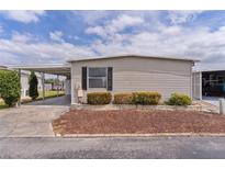 Charming single-story home with a carport and low-maintenance landscaping at 25 Captains Pt, Fruitland Park, FL 34731