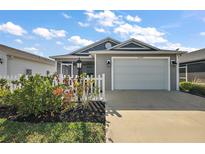 Charming single-Gathering home featuring a two-car garage, screened lanai, and beautiful landscaping at 6248 Siverson Ter, The Villages, FL 32163