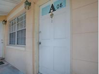 Exterior shot of unit's front door with the unit number and a window at 1400 Eudora Rd # A08, Mount Dora, FL 32757