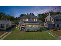 Charming two-story home with landscaped yard and inviting front porch showcasing curb appeal at 1109 W Line St, Leesburg, FL 34748