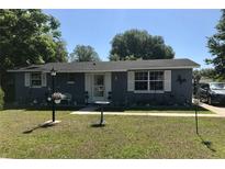 Charming single-story home with blue siding, white trim, and a well-manicured front yard at 14657 Sw 41St Ave, Ocala, FL 34473