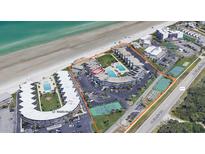 An aerial view shows the location of the beachfront condo complex with community pools and tennis courts at 4841 Saxon Dr # E206, New Smyrna Beach, FL 32169