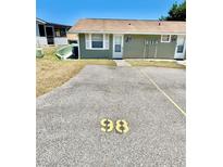 A cozy, single-story exterior with parking space in front of the unit, offering convenient access at 10301 Us Highway 27 # 98, Clermont, FL 34711