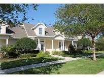 Charming single-Gathering home with well-manicured lawn, inviting walkway, and beautiful landscaping at 292 Nautica Mile Dr, Clermont, FL 34711