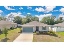 Charming single-story home features a well-maintained lawn, inviting entrance, and a two-car garage at 31799 Broadwater Ave, Leesburg, FL 34748