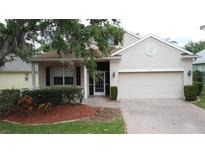 Charming single-Gathering home with a two-car garage and well-maintained landscaping at 807 Wolf Creek St, Clermont, FL 34711