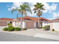 Charming home with mature landscaping and a two-car garage, perfect for comfortable living at 732 Ramirez Ave, The Villages, FL 32159