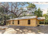 Exterior view of a home under construction with wooden framing and a partially completed roof at Lot 3 Indian Estates Cr 423, Lake Panasoffkee, FL 33538