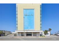 Exterior view of Oceanside Inn featuring large signage, a porte-cochere and a well-manicured entrance area at 1909 S Atlantic Ave # 311312, Daytona Beach, FL 32118