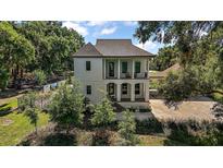 Stunning two-story home with a sophisticated exterior and a well-manicured lawn at 6905 Clayton St, Mount Dora, FL 32757