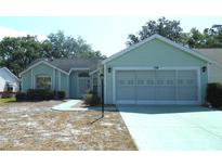 Charming single-story home featuring a two-car garage and inviting curb appeal at 739 Cortez Ave, The Villages, FL 32159