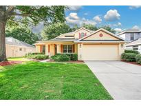 Charming single-Gathering home with a well-manicured lawn and a two-car garage at 3842 Beacon Ridge Way, Clermont, FL 34711