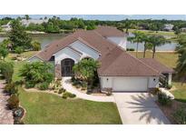 A charming single-Gathering home featuring manicured landscaping and a tranquil lake view, ideal for peaceful living at 2457 Bar Harbor, Mount Dora, FL 32757