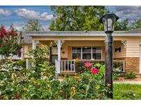 Charming home featuring a cozy front porch with beautiful landscaping and an inviting curb appeal at 8738 Sw 95Th Ln # B, Ocala, FL 34481