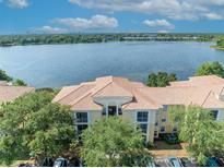 Beautiful condo complex with lake view, lush trees and well-maintained parking area at 1460 Lake Shadow Cir # 7102, Maitland, FL 32751