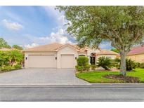 Charming single-story home features a lush landscaped yard and a welcoming two car garage at 537 Montage Ln, Kissimmee, FL 34759