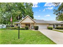 Charming single-story home with a well-maintained lawn and attached garage at 8709 Sw 96Th St # A, Ocala, FL 34481