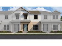 Charming new two-story townhome featuring a light blue front door and neutral color palette at 6480 Barnstorm Way, St Cloud, FL 34771
